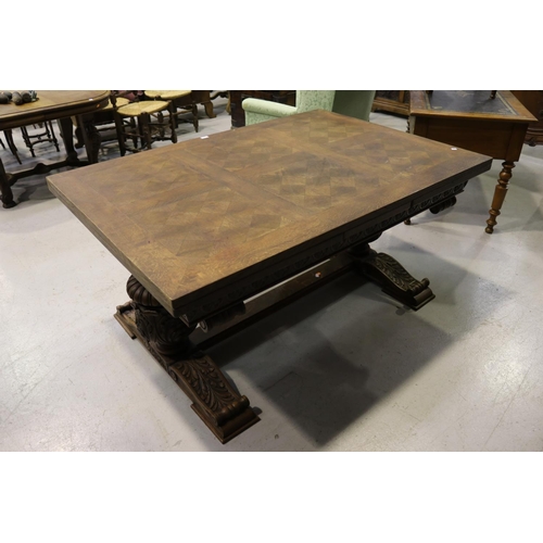 186 - French parquetry topped drawer leaf dining table, with large carved bulbous supports with scroll out... 