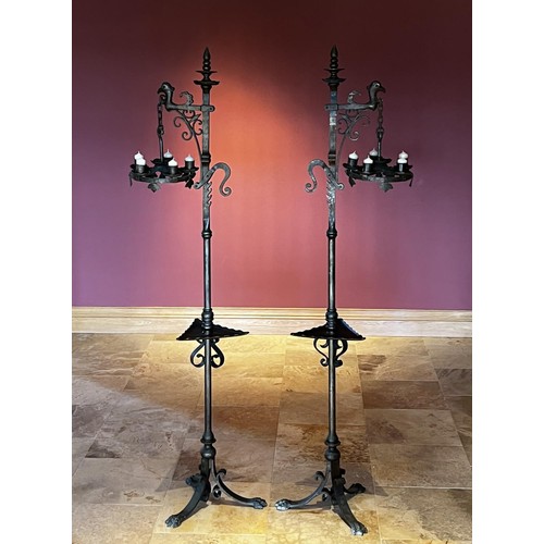 1112 - Pair of antique wrought iron Renaissance revival adjustable height pickets. Griffin head arm holding... 