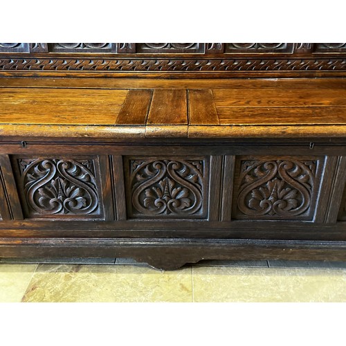 1144 - Antique English oak settle hall bench, well carved back, lift up seat compartment. Label for retaile... 