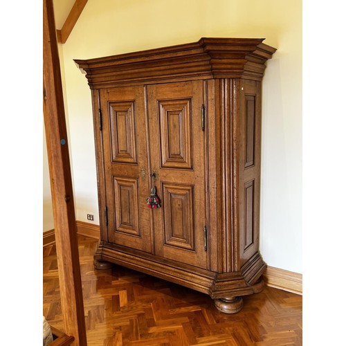 1147 - Antique European oak two door armoire, recessed panelled two doors, flanked by fluted canted sides. ... 