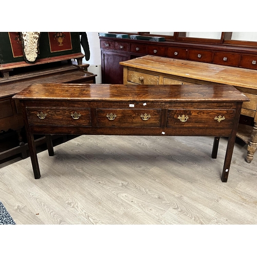 1033 - Antique rustic 18th century English oak three drawer dresser, standing on square legs, approx 79cm H... 