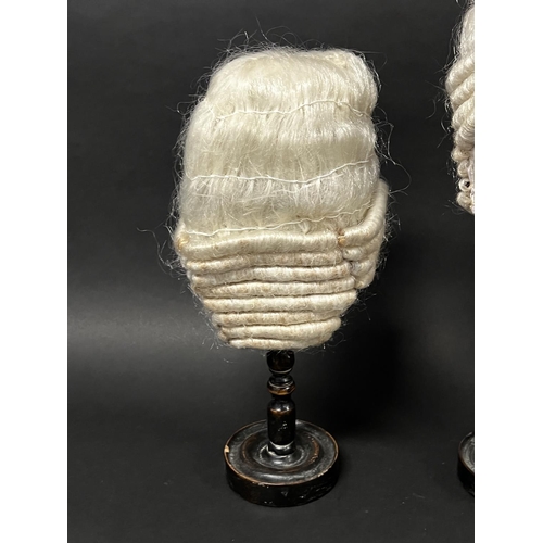 1102 - Three turned wood hat or wig stands with three wigs, approx 45.5cm H and shorter (3)