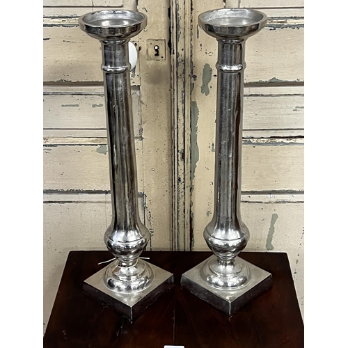 1103 - Pair of tall modern metal candlesticks, approx 59.5cm H (2)