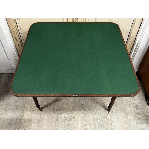1115 - Antique Regency fold over card table canted front, with ebony stringing and inlaid buttons, standing... 