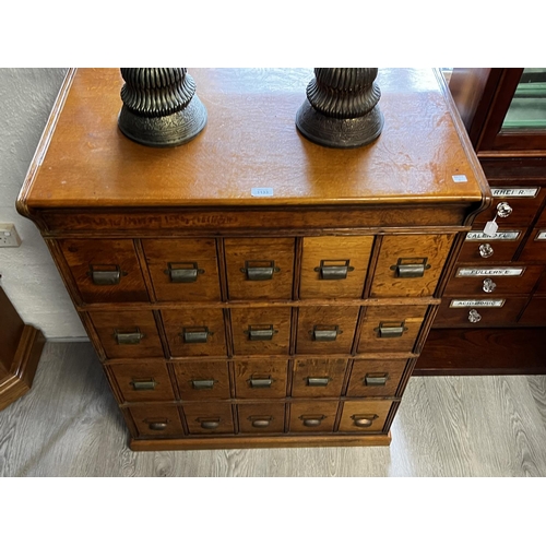 1133 - Good antique English oak 20 drawer filing cabinet, with brass cup pulls, engraved Shannon, approx 11... 