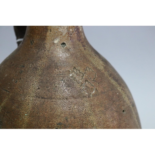 1298 - Antique 17th century Bellermine pottery jug with a floral decoration, approx 34cm H
Circa 1670's