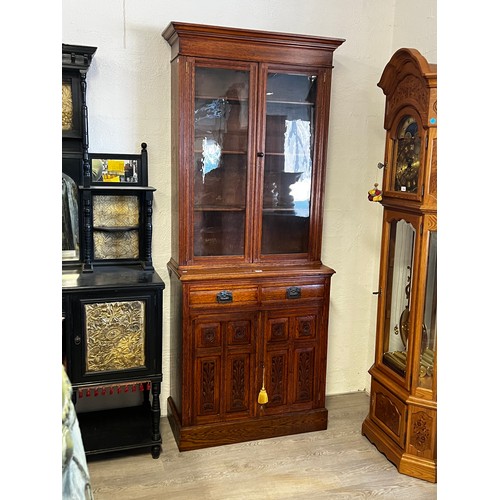 1135 - Petit Antique English oak two height bookcase, carved in high relief to the two door base, approx 22... 