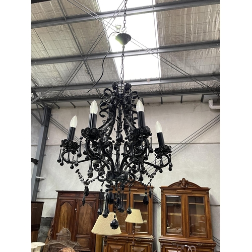 1369 - Black glass six light chandelier, with applied tear drops and chains, approx 77cm H
