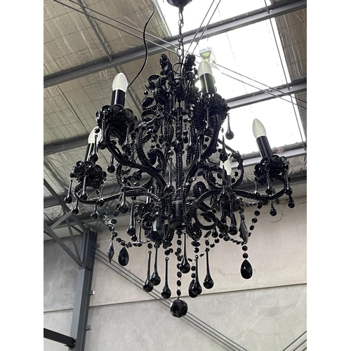 1369 - Black glass six light chandelier, with applied tear drops and chains, approx 77cm H