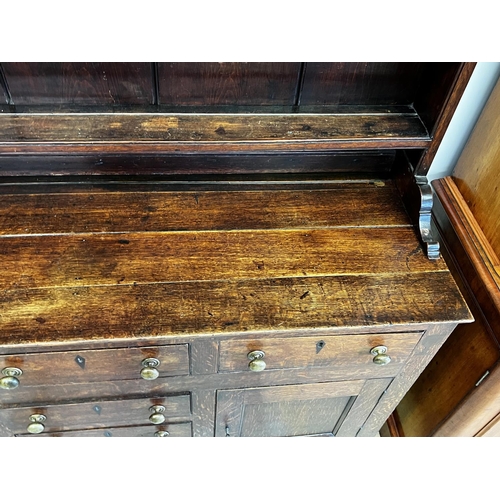 1319 - Antique early 19th century English oak Welsh Dresser, top spindle rack open shelf top, over a six dr... 