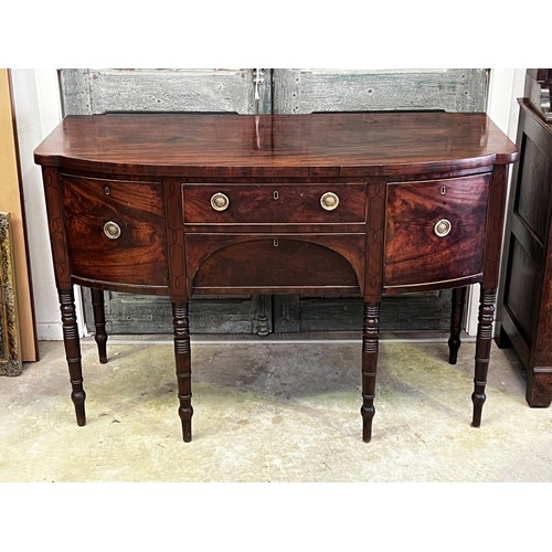 1330 - Antique English Regency mahogany bow front sideboard. Two central drawers flanked by a deep drawer a... 