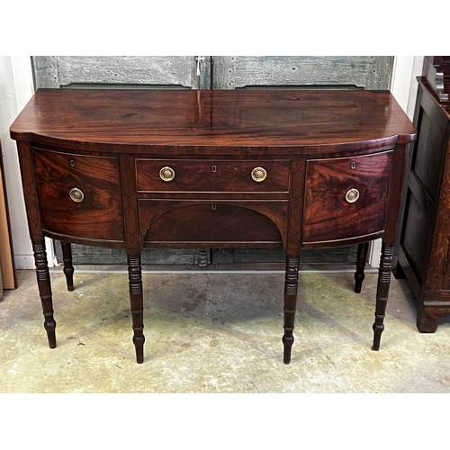 1330 - Antique English Regency mahogany bow front sideboard. Two central drawers flanked by a deep drawer a... 