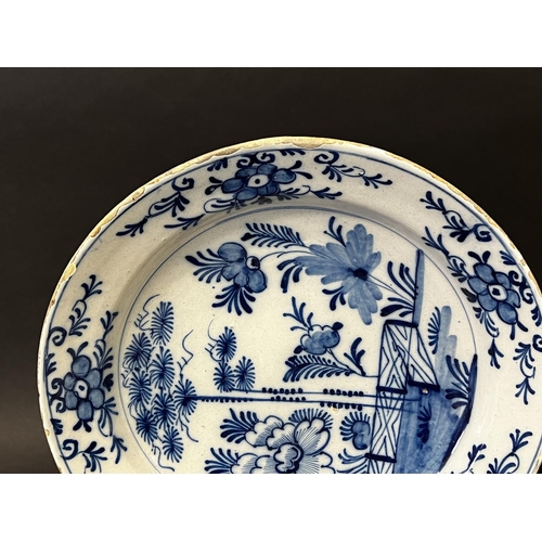 1353 - Antique 18th century Delft blue and white charger, with trellis fence , flowers and foliage, approx ... 