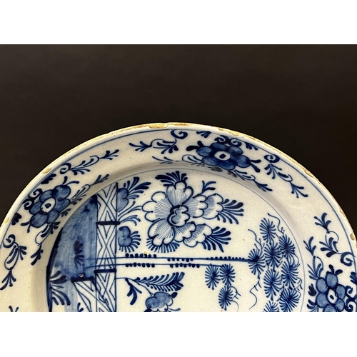 1353 - Antique 18th century Delft blue and white charger, with trellis fence , flowers and foliage, approx ... 