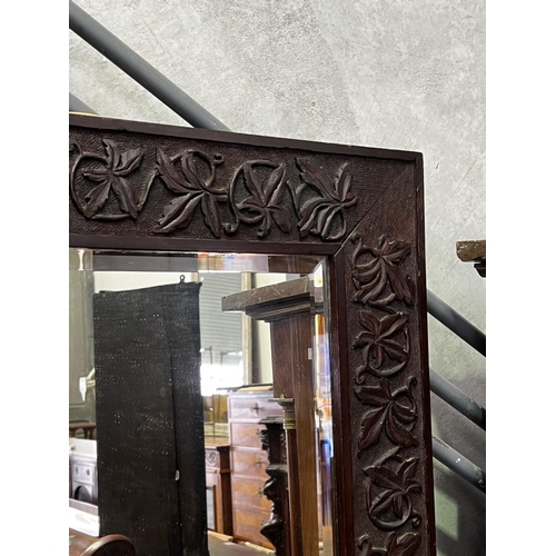 1333 - Antique carved surround bevelled edge mirror, 73cm H x 73cm W