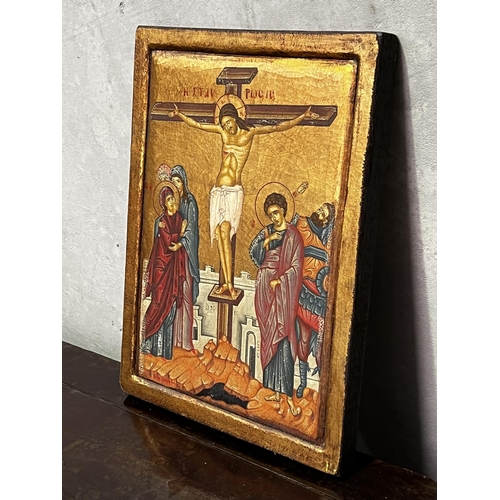 1339 - The Greek orthodox Crucifixion Icon painted and gilt hardwood panel, signed lower left, approx 40 cm... 