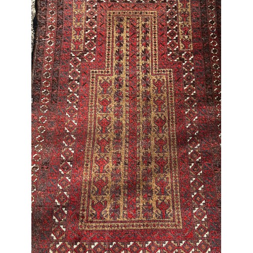 1120 - Vintage hand knotted wool prayer carpet, of red ground, approx 134cm x 80cm