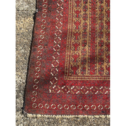 1120 - Vintage hand knotted wool prayer carpet, of red ground, approx 134cm x 80cm