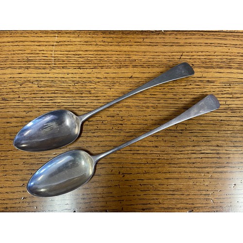 1141 - Two antique English Georgian sterling silver serving spoons, each old English pattern, one marked fo... 