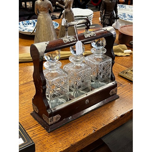 1108A - Three bottle antique tantalus with key in oak frame, approx 36cm H x 36cm W