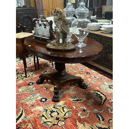 1377 - Antique oval table, single baluster support, on a quatrefoil base with lions paw feet, approx 73cm H... 