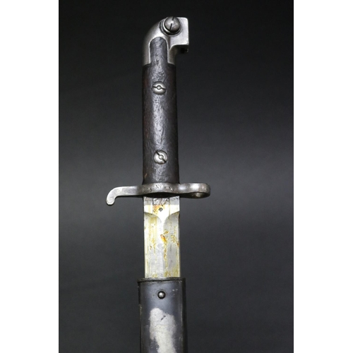22 - Swedish Model 1914 bayonet and scabbard (Kiesling 227). Tiny piece of wood lacking from top of one g... 