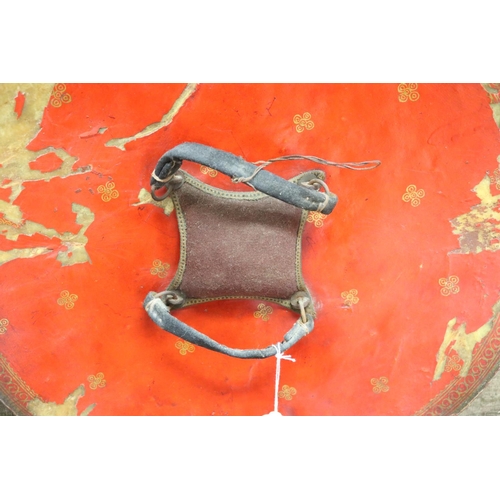 5 - Indian Dahl of circular form in painted leather, complete with its hand grips and padded buffer, a n... 