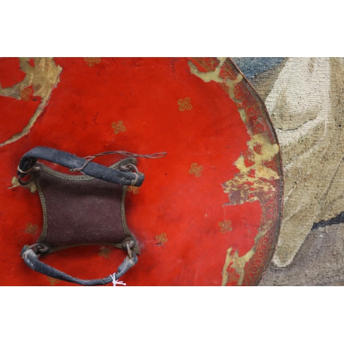 5 - Indian Dahl of circular form in painted leather, complete with its hand grips and padded buffer, a n... 