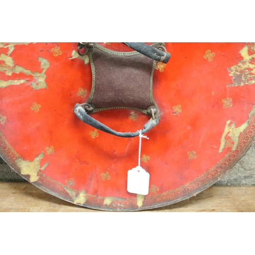 5 - Indian Dahl of circular form in painted leather, complete with its hand grips and padded buffer, a n... 