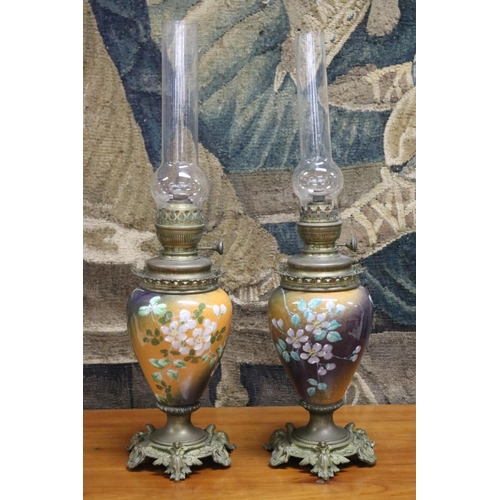 88 - Pair of antique French painted pottery oil lamps, cast brass bases, marked Matador to burners mount,... 