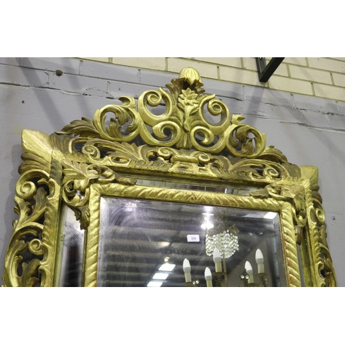 119 - Large antique 19th century French giltwood pierced surround cushion mirror, with central elaborate c... 