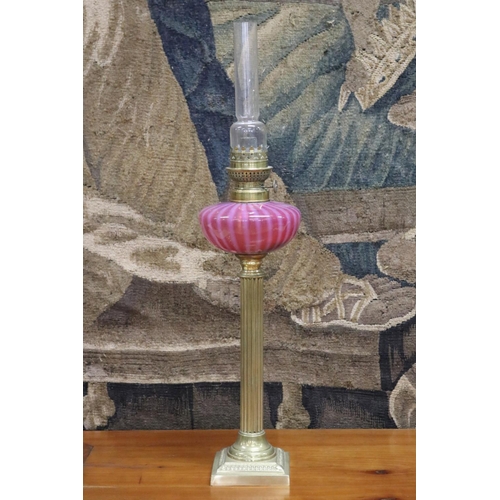 155 - Antique oil lamp, ruby and vaseline reservoir with brass column and base, approx 68cm H