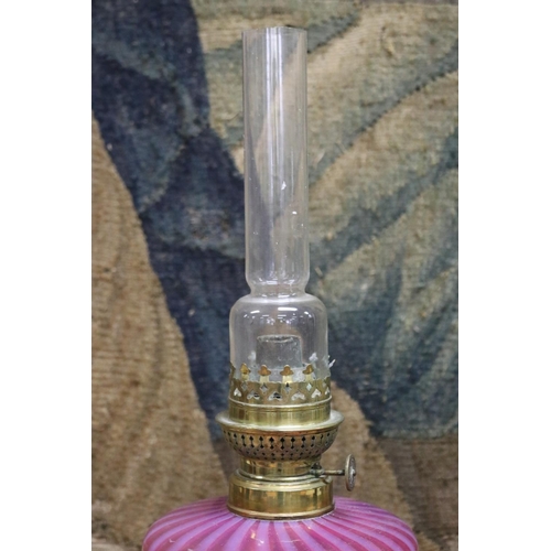 155 - Antique oil lamp, ruby and vaseline reservoir with brass column and base, approx 68cm H