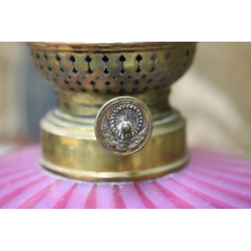 155 - Antique oil lamp, ruby and vaseline reservoir with brass column and base, approx 68cm H