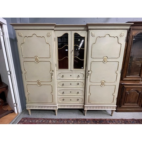 162 - Antique early 20th century Hollywood regency cream painted inverted break front two door armoire, wi... 