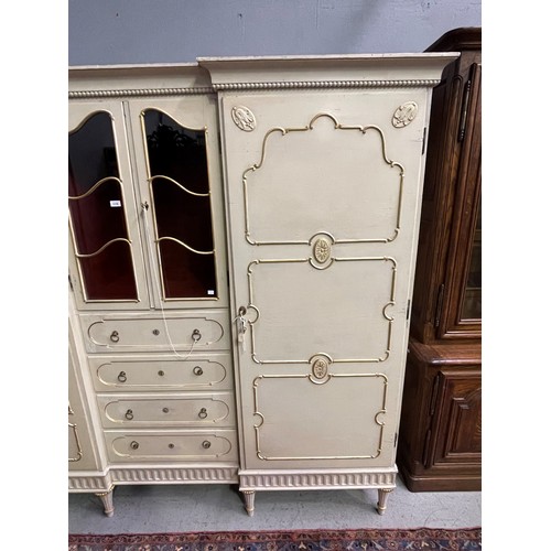 162 - Antique early 20th century Hollywood regency cream painted inverted break front two door armoire, wi... 