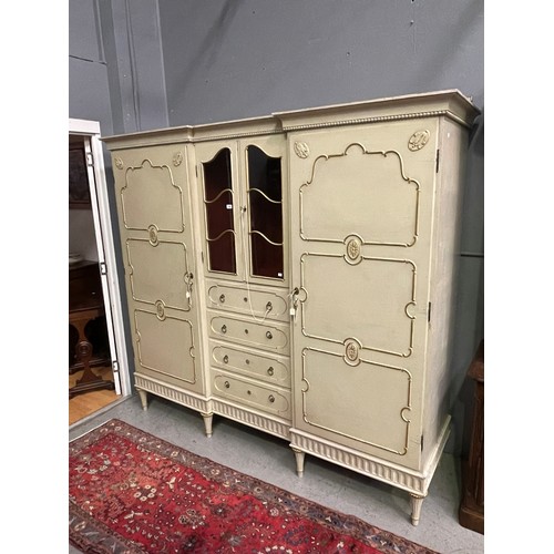 162 - Antique early 20th century Hollywood regency cream painted inverted break front two door armoire, wi... 