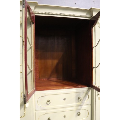 162 - Antique early 20th century Hollywood regency cream painted inverted break front two door armoire, wi... 