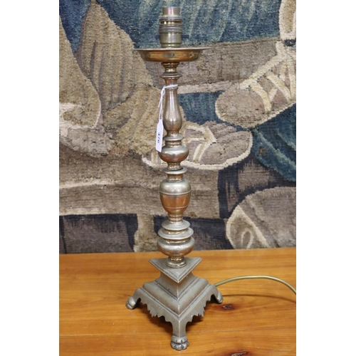 173 - Bronze tri footed pricket converted into a lamp, unknown working order, approx 45cm H