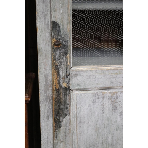 192 - Antique rustic French milk painted cupboard, distressed, chicken wire and enclosed bottom door, appr... 