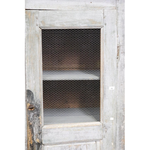 192 - Antique rustic French milk painted cupboard, distressed, chicken wire and enclosed bottom door, appr... 