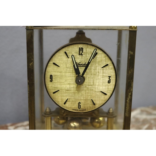 112 - Small glass clock with brass frame, back glass missing, no key, unknown working condition, approx 17... 