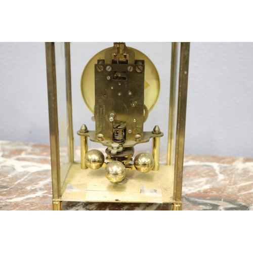 112 - Small glass clock with brass frame, back glass missing, no key, unknown working condition, approx 17... 