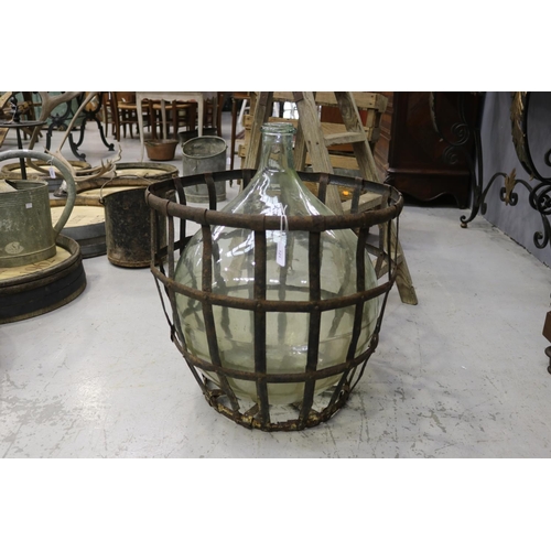 121 - Large French handblown glass winemakers bottle with metal basket cage, approx 60cm H x 55cm Dia