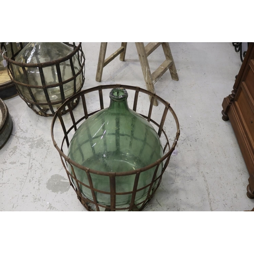 122 - Large French handblown glass winemakers bottle with metal basket cage, approx 64cm H x 60cm Dia