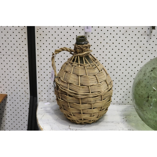 255 - Glass bon bon in woven jug with handle, approx 32cm H