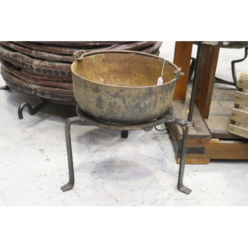 295 - French iron pot on wrought iron stand, approx 44cm H ex handle x 38cm Dia