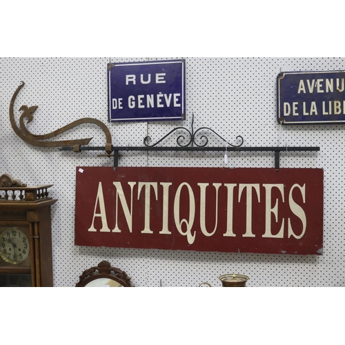 318 - Antiquities sign on metal frame with detachable bracket, approx 83cm H x 158cm W including bracket (... 