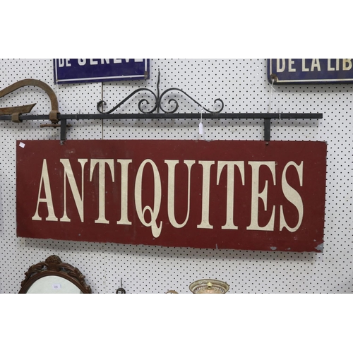 318 - Antiquities sign on metal frame with detachable bracket, approx 83cm H x 158cm W including bracket (... 