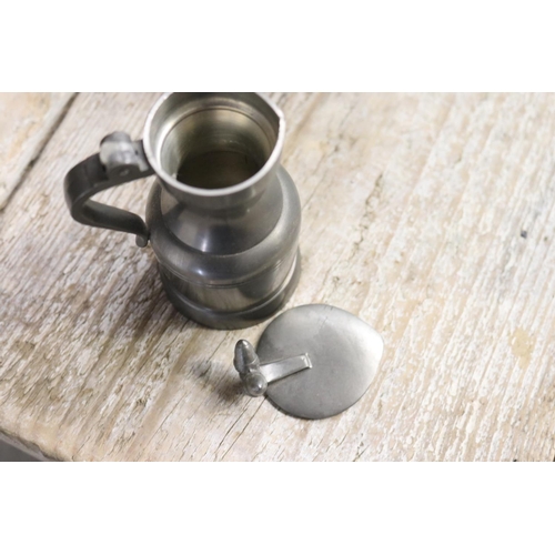 447 - Set of graduating lidded pewter jugs, approx 25cm H and shorter (5)